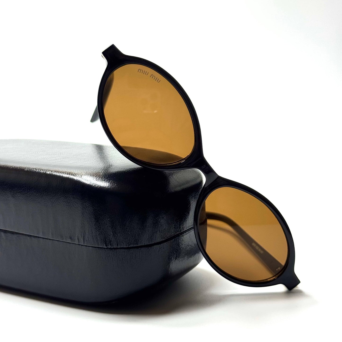 Miu Miu Oval – Black Brown